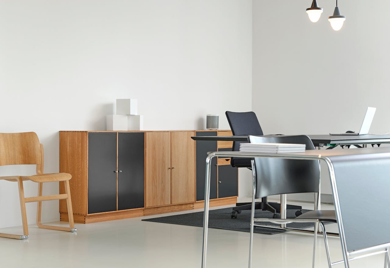 hero-img-02 A clean and organized modern office space with stylish furniture and decor.